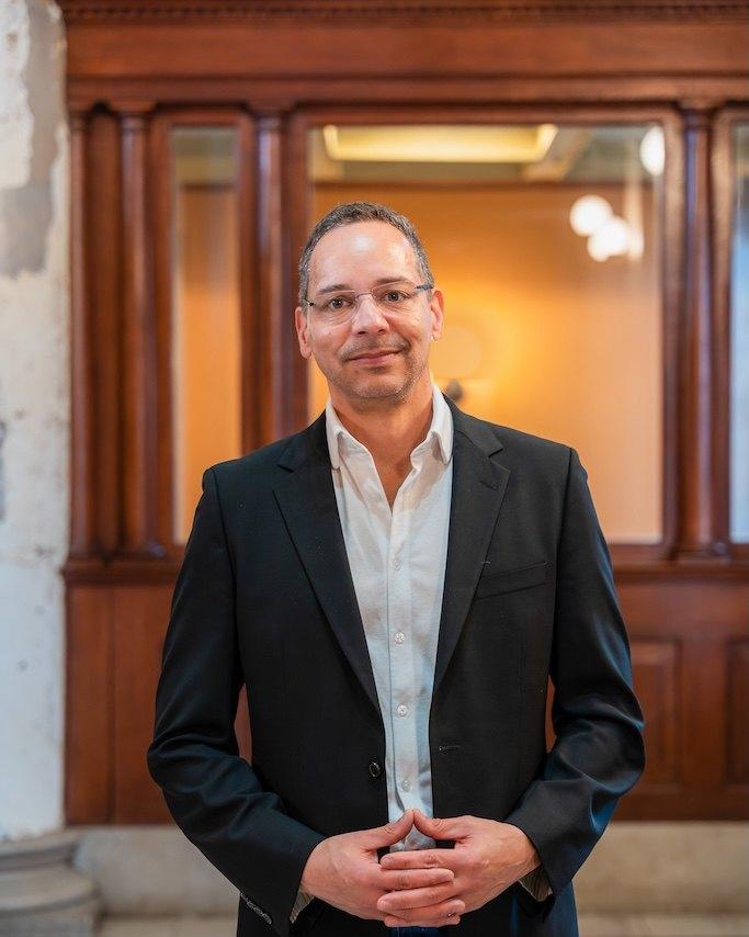 Portrait of Lieven DeGeyndt in a dark blazer and white shirt